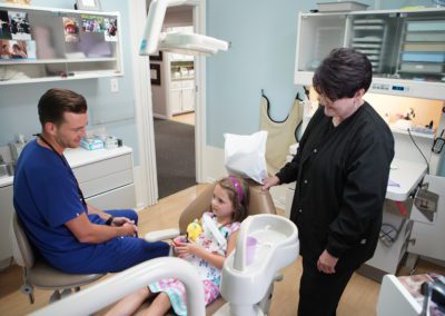 Young girl at the dentist's office with Dr. Austin