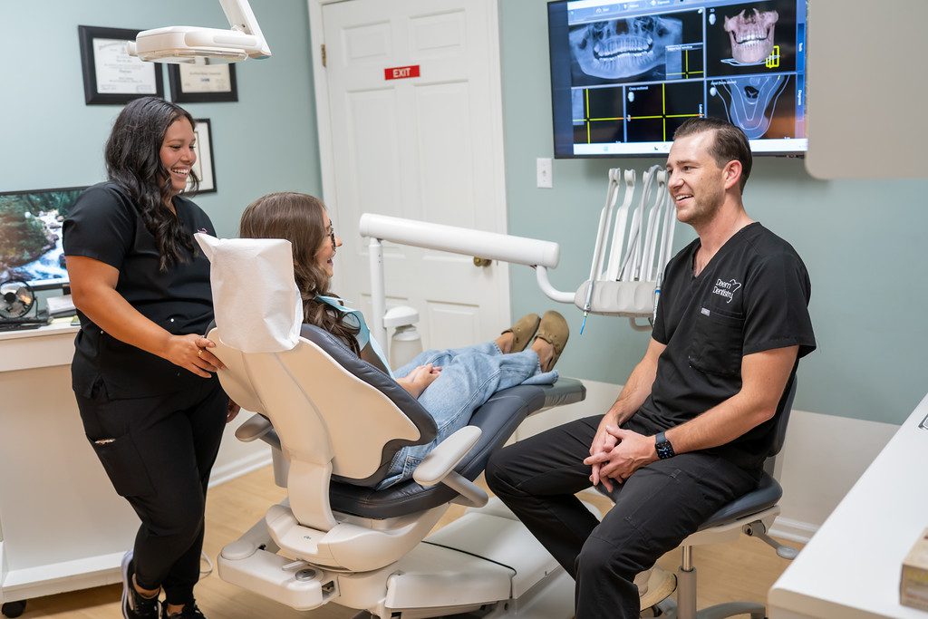 Young boy at a teeth cleaning with a dental hygienist at Deem Dentistry